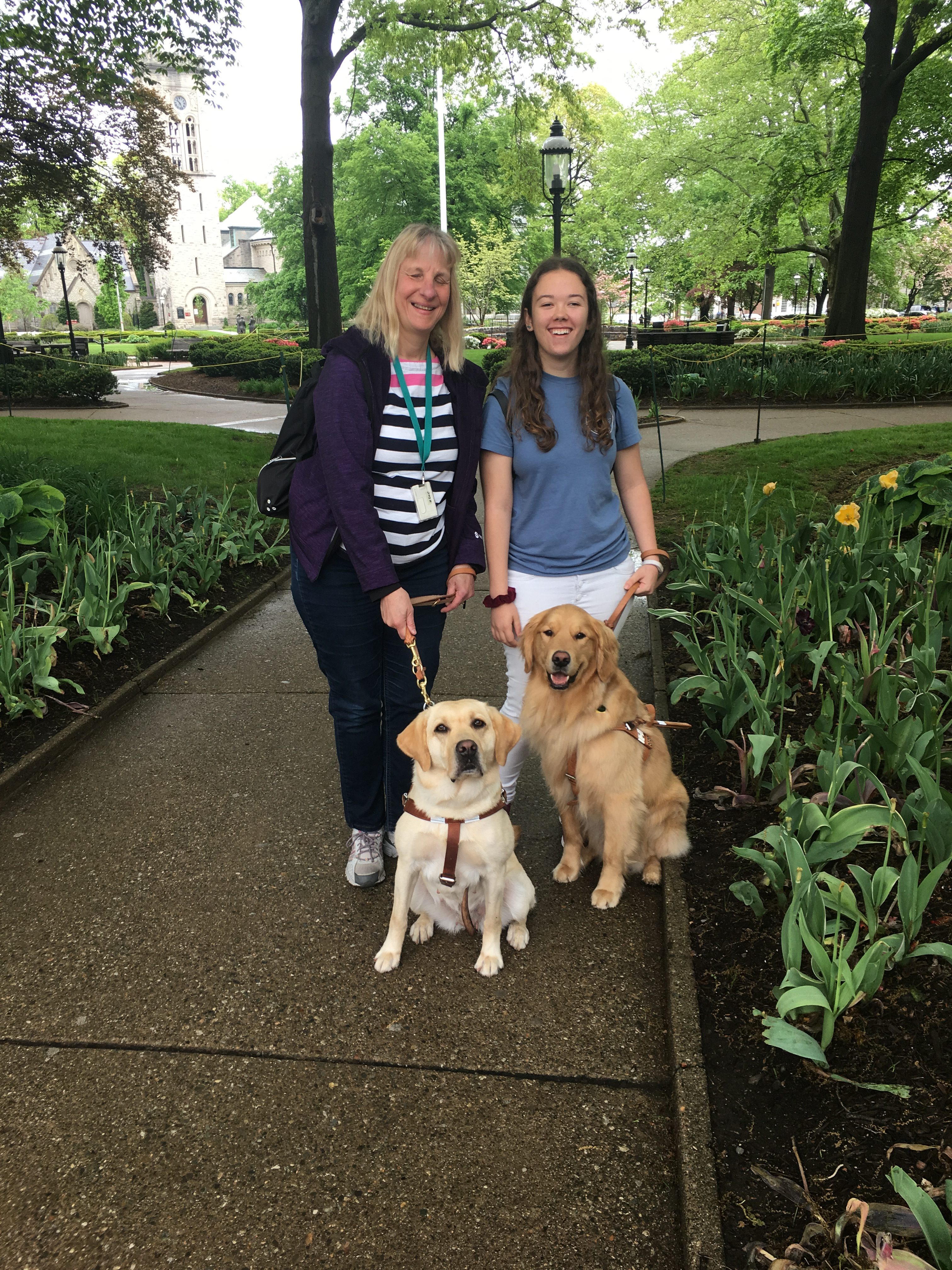 Judy and classmate, Shelbi, with their dogs in the park (Morristown Green)